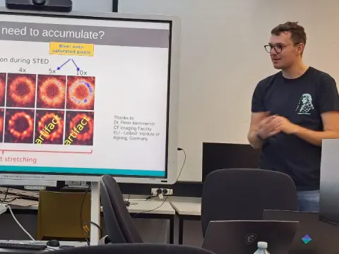 Presenter explaining advanced deconvolution and image analysis